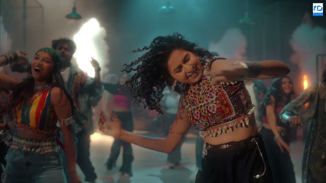 Kinjal Dave dancing with a crowd behind her