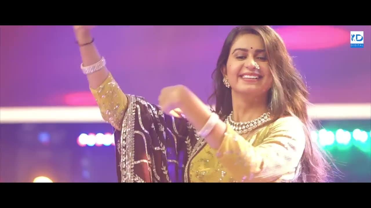Kinjal Dave dancing in a pink-lit set